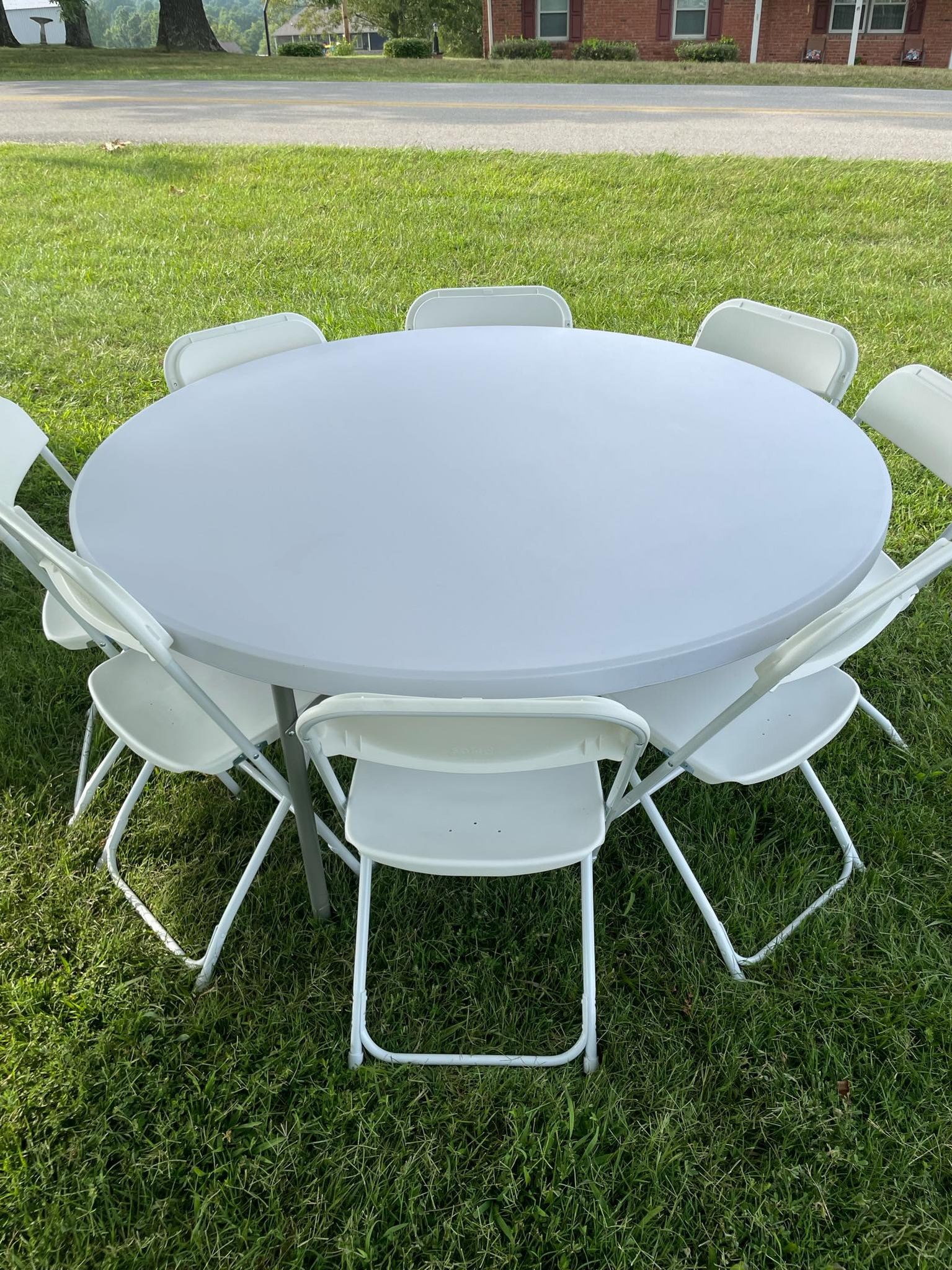 60" round table with plastic folding chairs